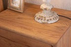 Oak Two-Drawer Nightstand with Round Handle Detail