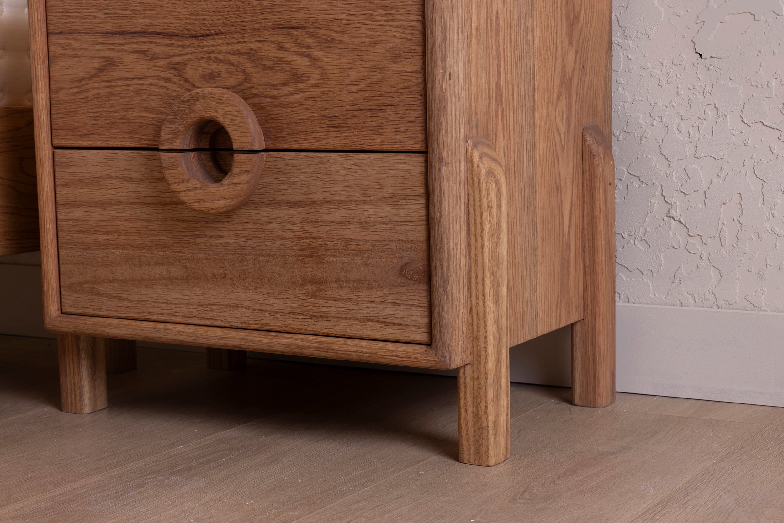 Oak Two-Drawer Nightstand with Round Handle Detail